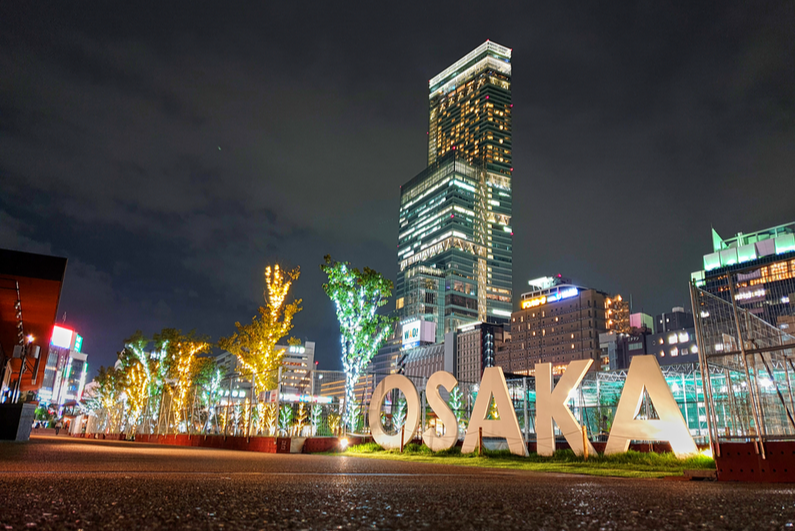 Osaka sign in a park at night